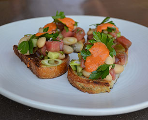 Grilled Bread with White Beans, Roasted Tomato, Parsley Salad and Smoked Paprika Rouille